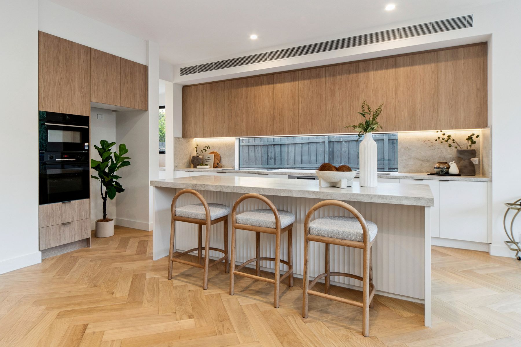 Mt Eliza townhouse kitchen with island and under-cabinet lighting