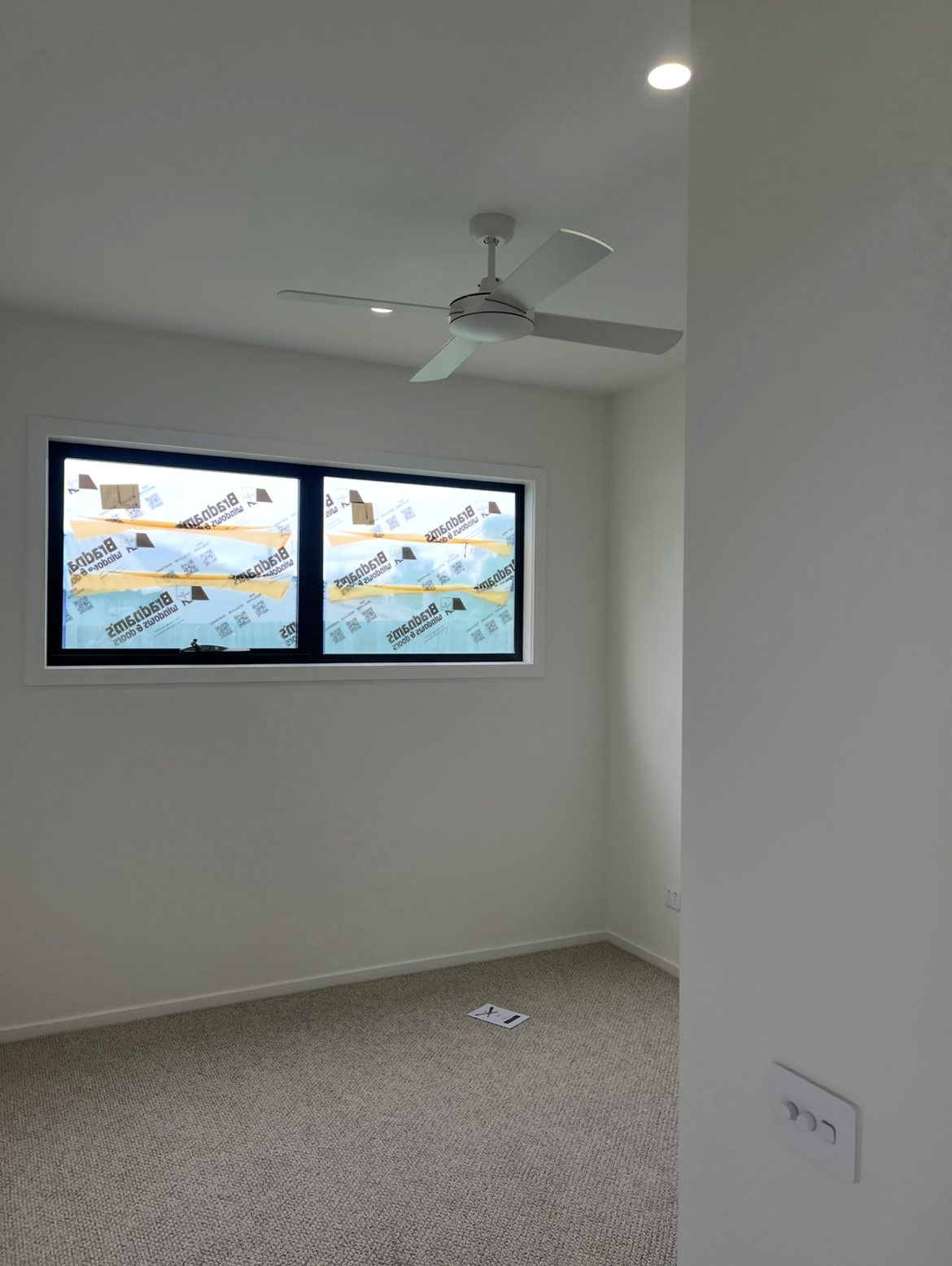 Somerville new build bedroom with ceiling fan and downlight