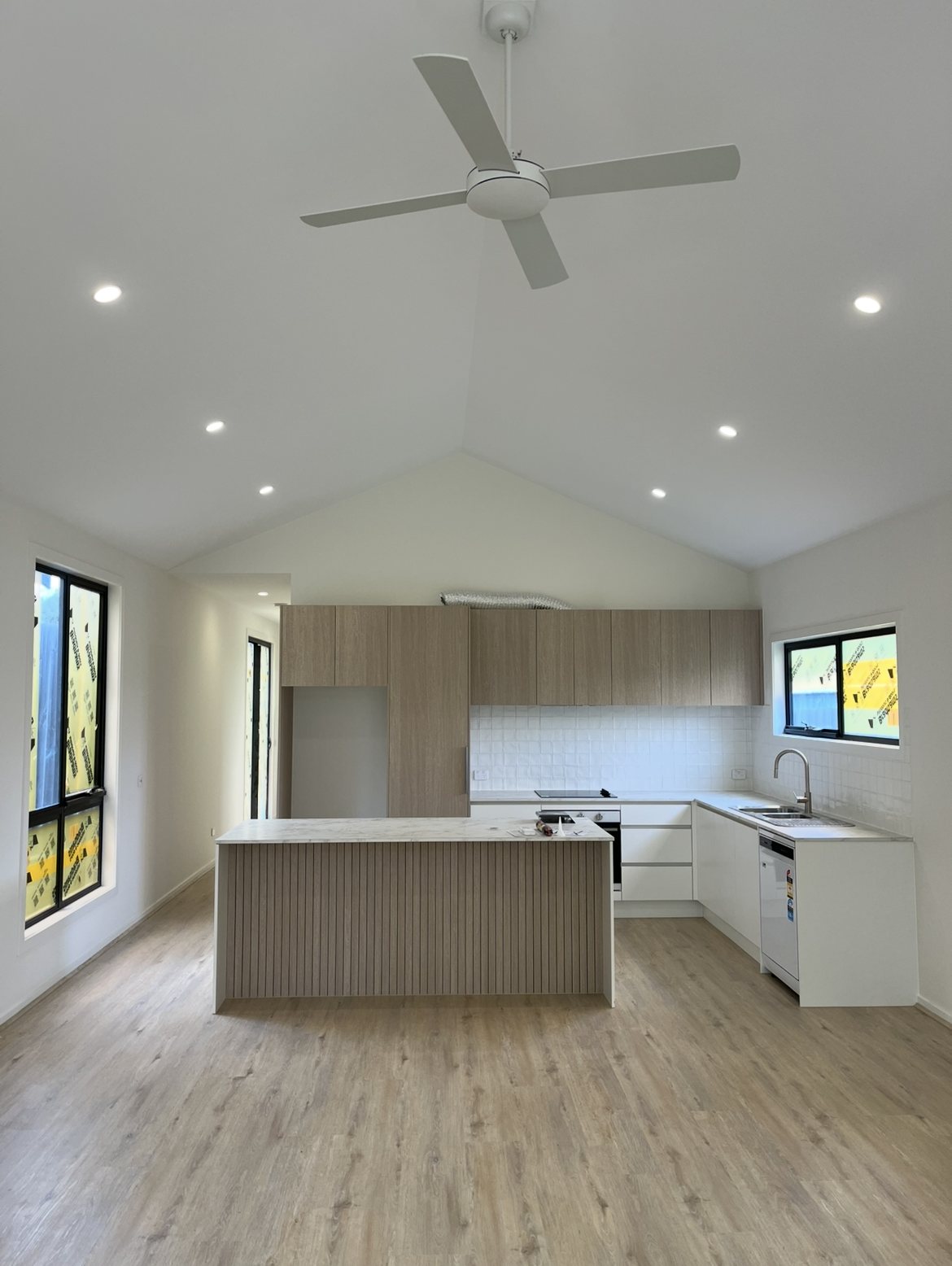 Somerville new build kitchen with vaulted ceiling, downlights and ceiling fan